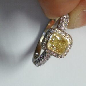 Radiant Sunburst: A 1-Carat Fancy Yellow Diamond Halo Ring
