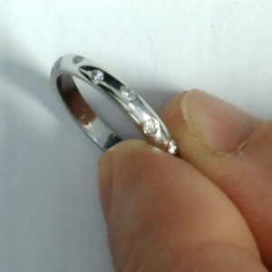 Eternity's Whisper: A Delicate Diamond Accent Band