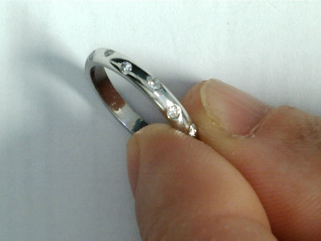 Eternity's Whisper: A Delicate Diamond Accent Band