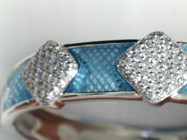 Azure Elegance: A Diamond & Custom-Cut Topaz Bangle